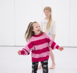 A young person in a studio dancing.